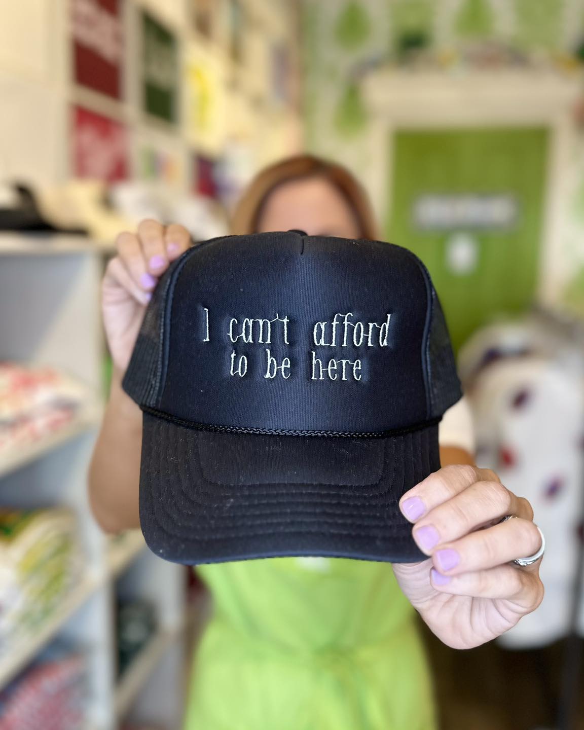 Can't Afford to Be Here Trucker Hat